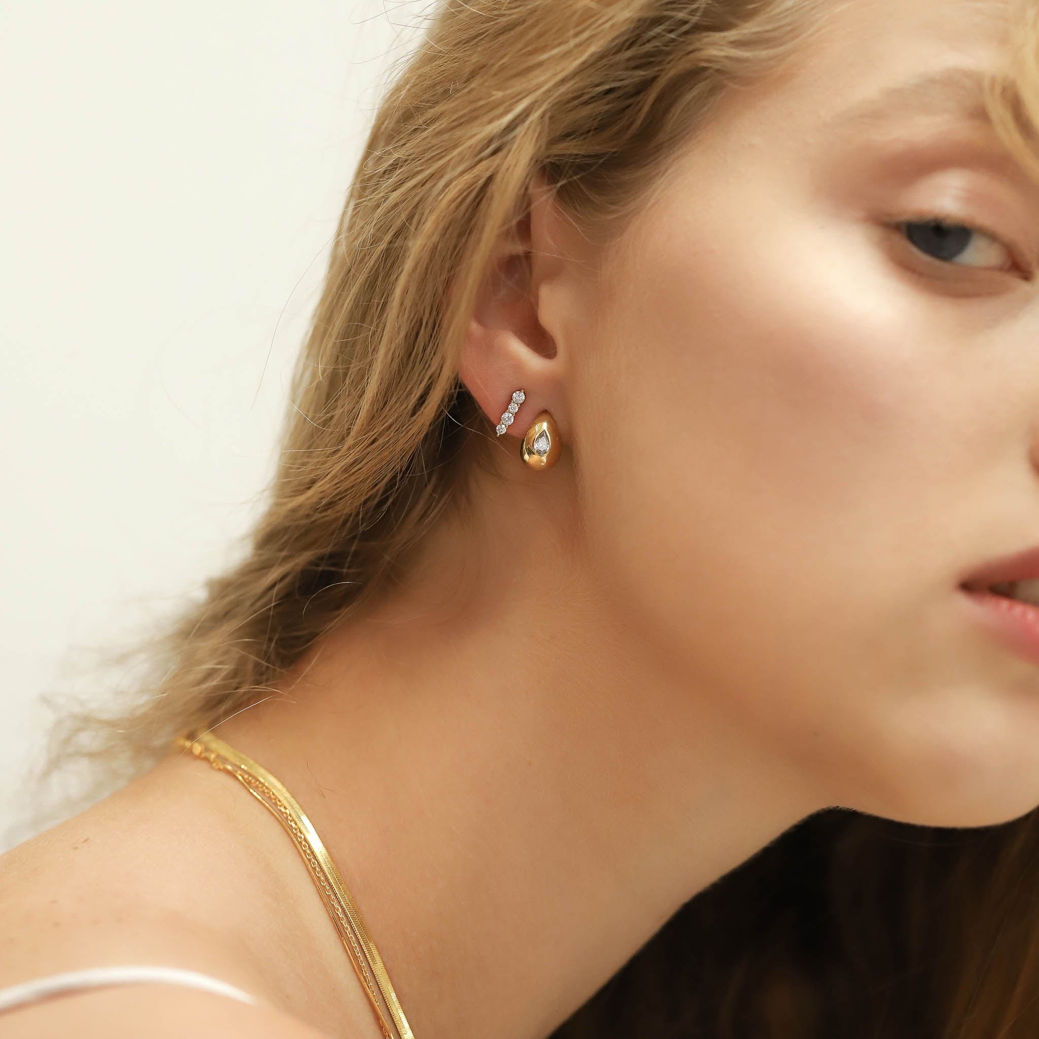 TAI JEWELRY Earrings Tear Shaped Huggie with Embedded CZ Stone
